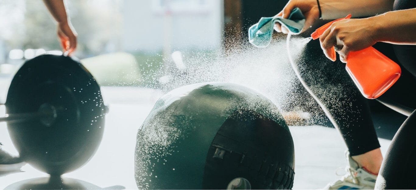 Woman cleaning medicine ball